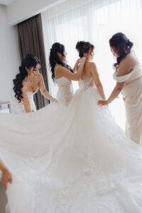 Bridesmaids and bride getting hairstyle and makeup by bridal glam ...
