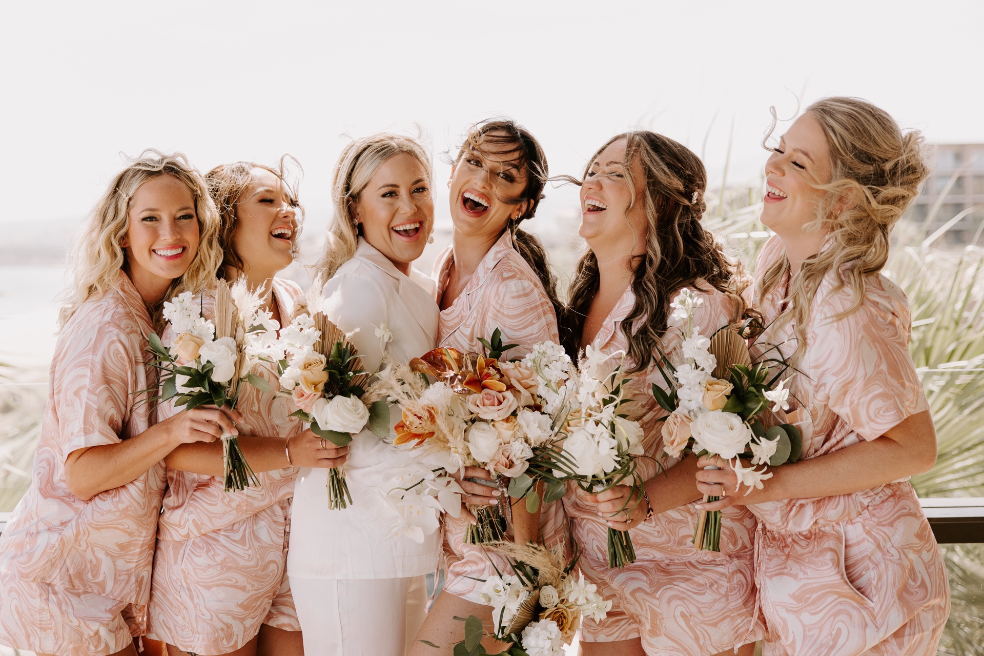 Curled ends on shoulder-length hair for effortless bridesmaid match. Sunset Los Cabos - Bridal Glam